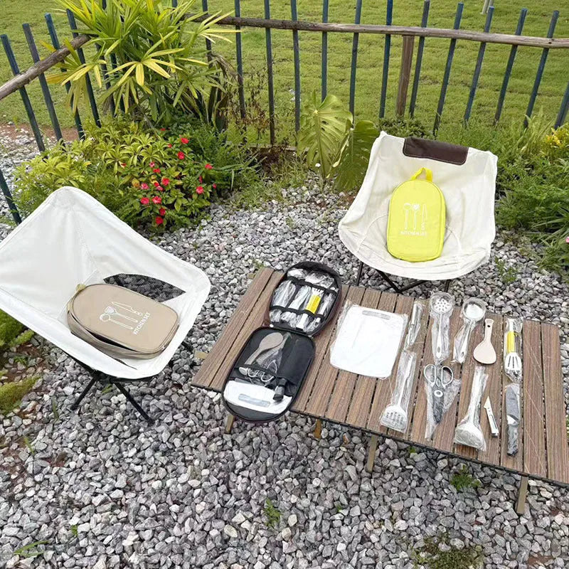 12-piece stainless steel picnic kitchenware set inside a khaki portable storage bag.