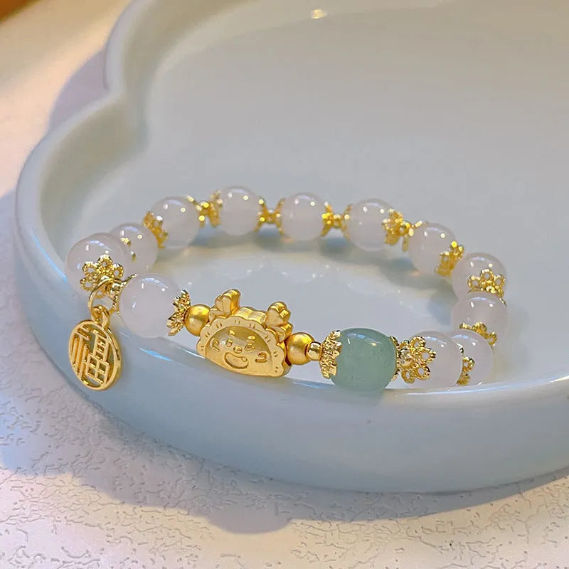 Women's floral glazed bracelet with zodiac animal beads in red, pink and white pearl colour options