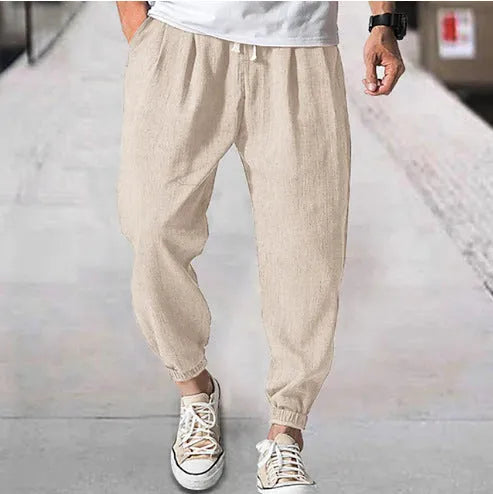 Men's loose cotton summer trousers with banded ankle cuff in light green colour