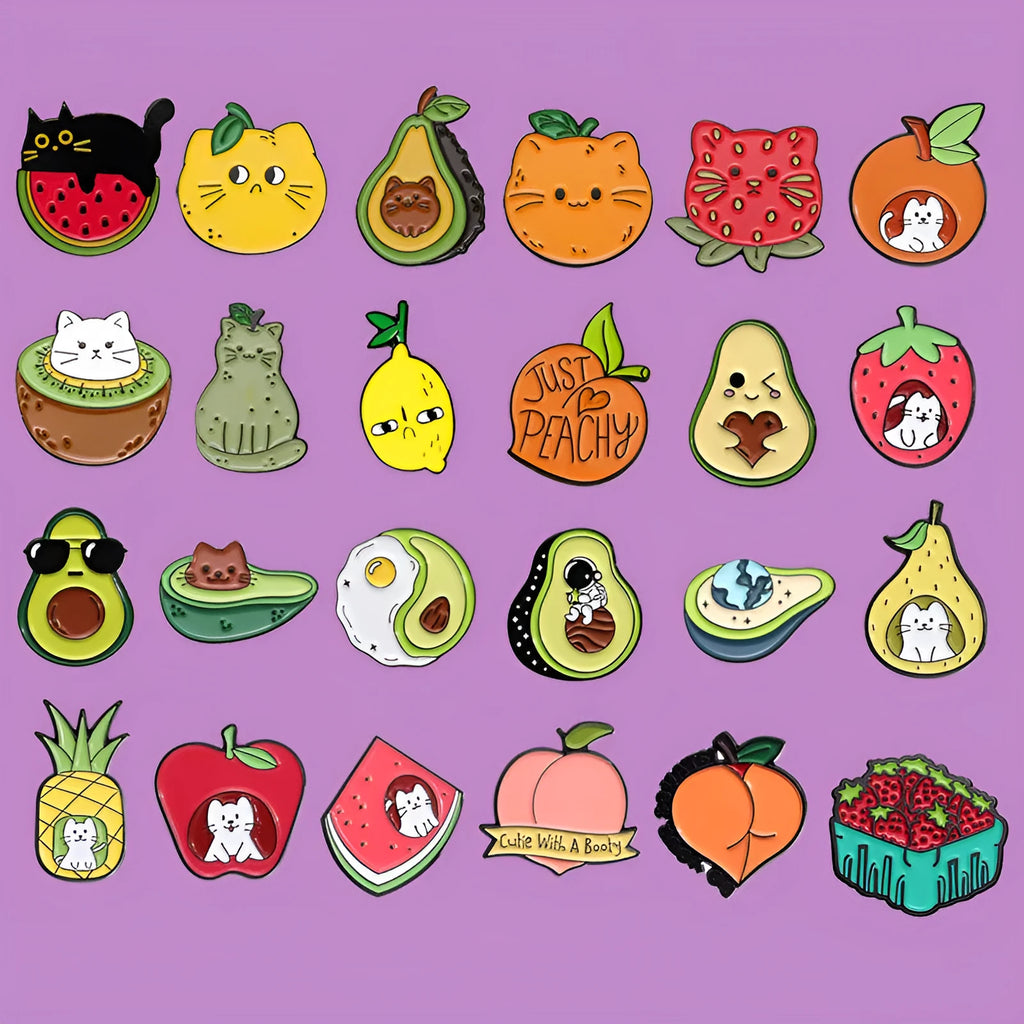Colourful cartoon fruit design metal brooch pin on a fabric background.