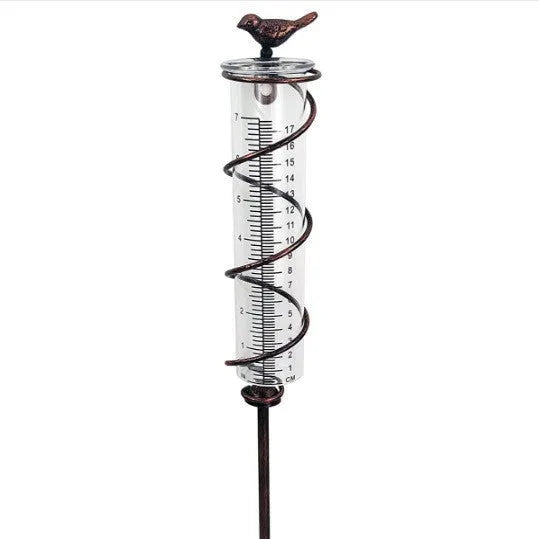 Cast iron bird garden rain gauge with glass measuring tube showing hummingbird design