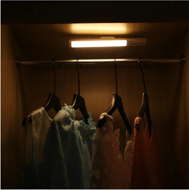 A slim 260mm long white LED strip light with a magnetic back for cabinet mounting.