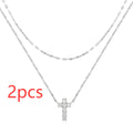 S925 sterling silver double layer cross pendant necklace with diamond accents on a clavicle chain.