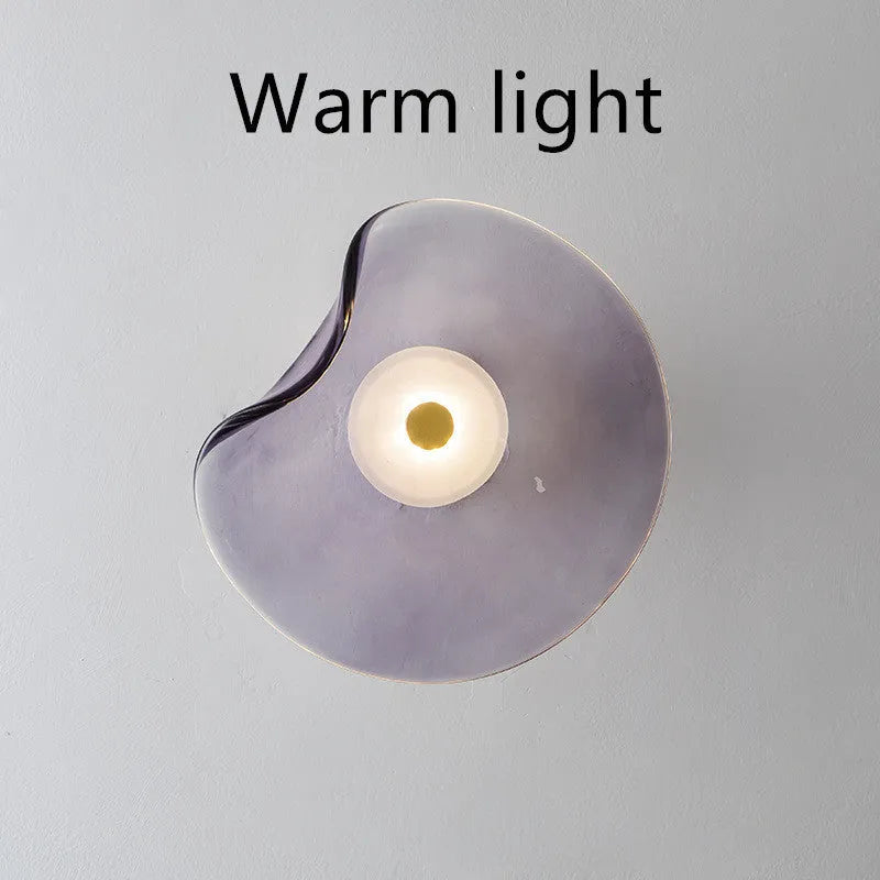 Round glass wall lamp in cognac colour with diffused lighting for bedroom bedside decoration