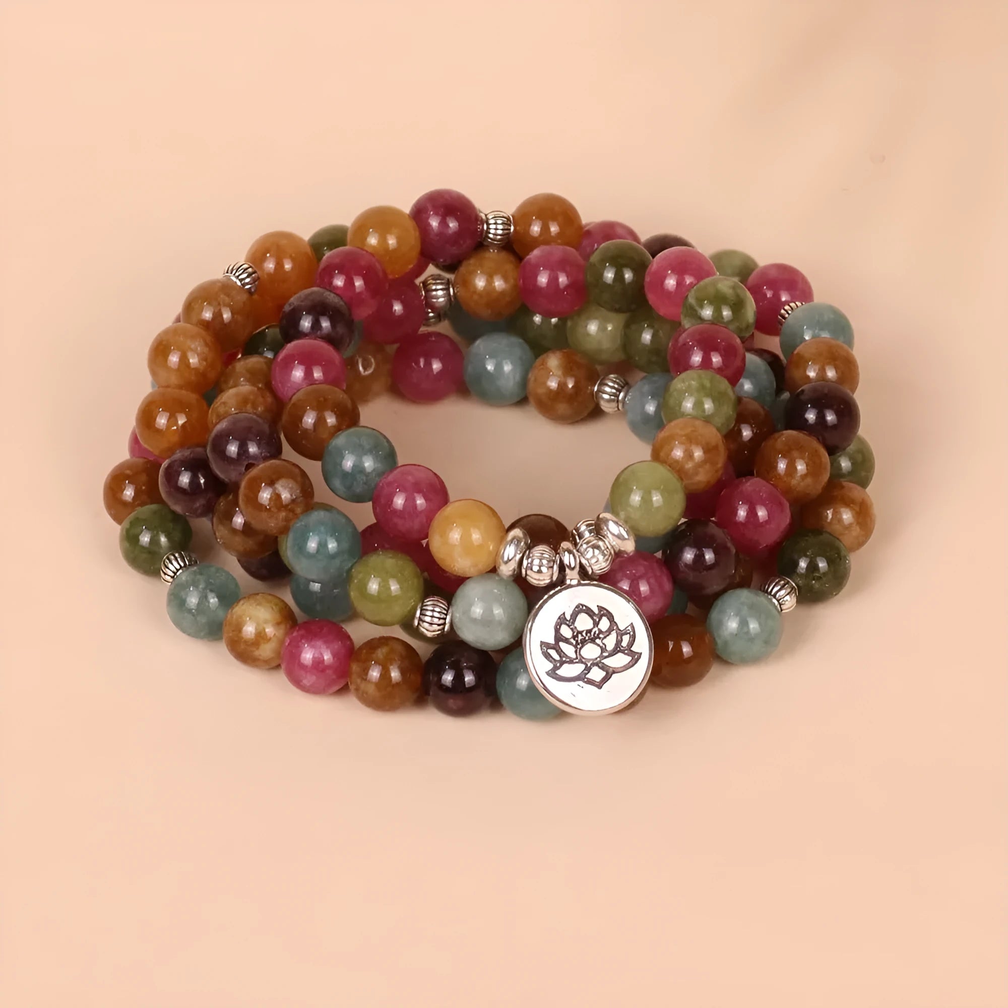 Multi-layer bracelet with 108 beads, a lotus charm, in Tourmaline-coloured alloy.