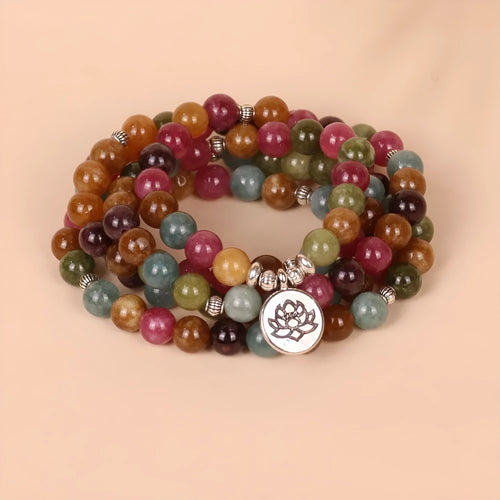 Multi-layer bracelet with 108 beads, a lotus charm, in Tourmaline-coloured alloy.