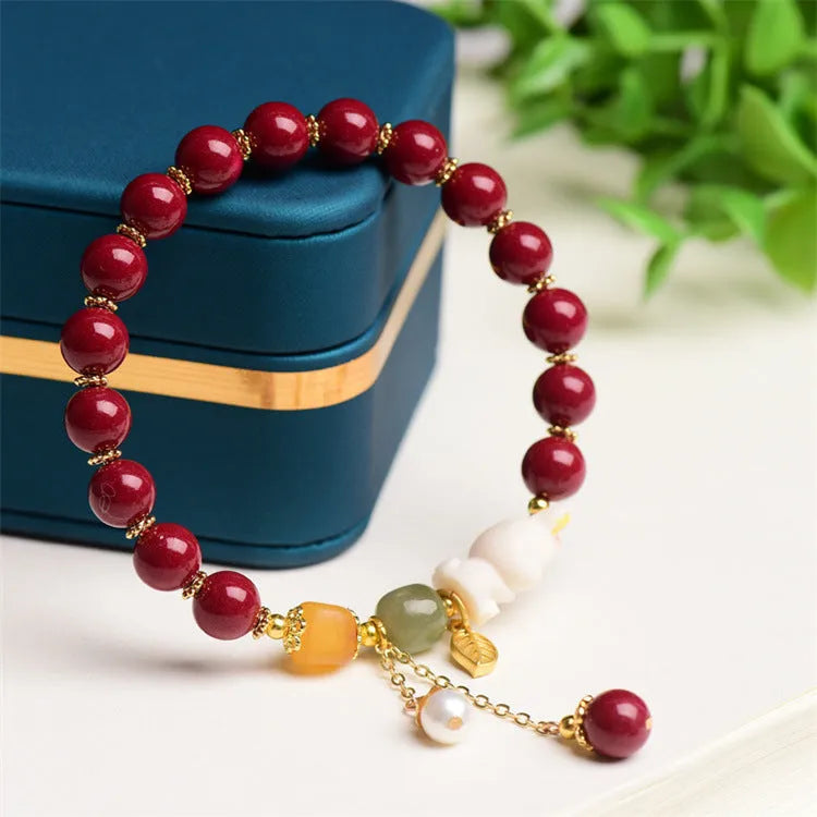 Natural beeswax purple gold sand bracelet with a detailed hand-carved cinnabar rabbit charm.