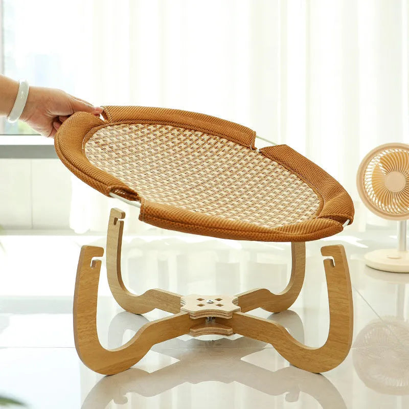 Brown rattan woven elevated pet bed measuring 46cm square with 17.5cm height