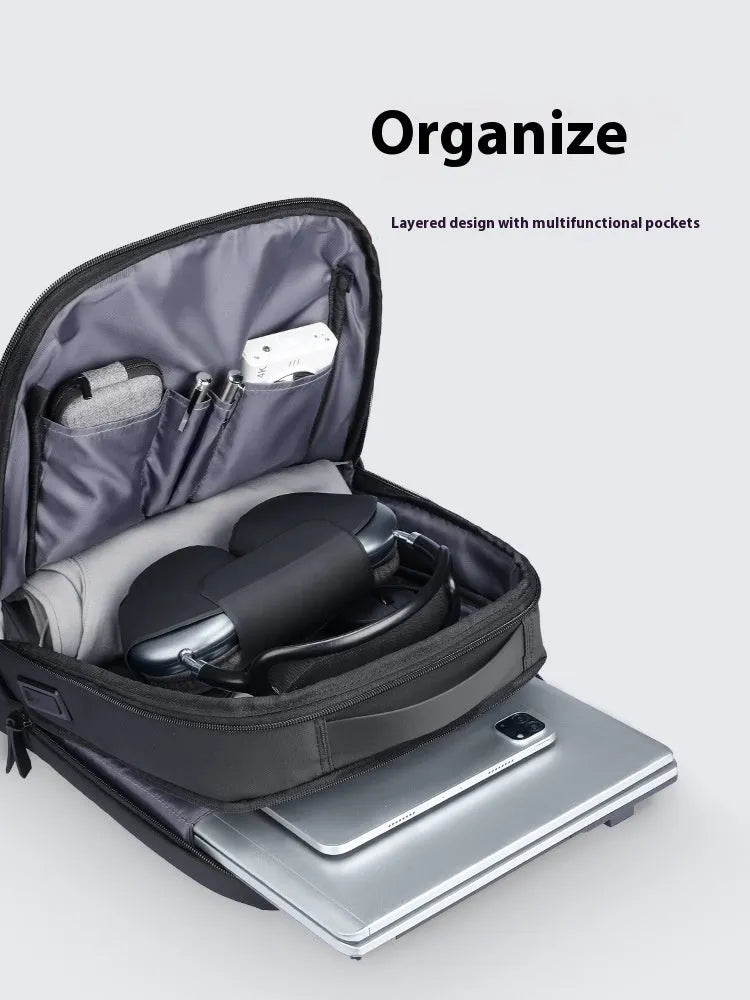 Graphite grey USB charging business backpack with Oxford cloth construction showing external USB port