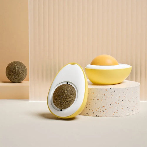 Soft plush catnip ball toy with suction cup mounted on a wall, shown in fried egg and poached egg shapes.