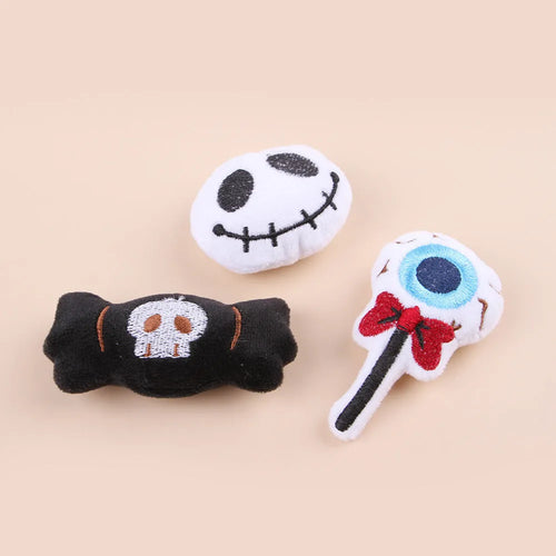 Colourful plush cat tease stick with candy, eyes and skull designs on small wand toy