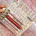 Set of five retractable ballpoint pens with funny nurse-themed graphics and copywriting.