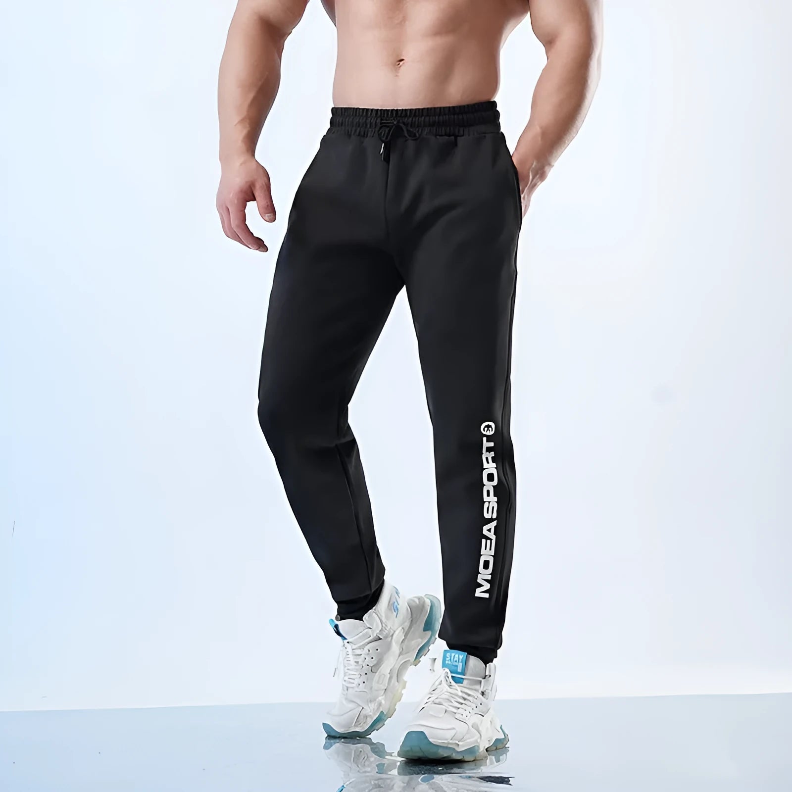 Men's black air layer ankle-tied sweatpants with mid waist design and polyester-spandex fabric