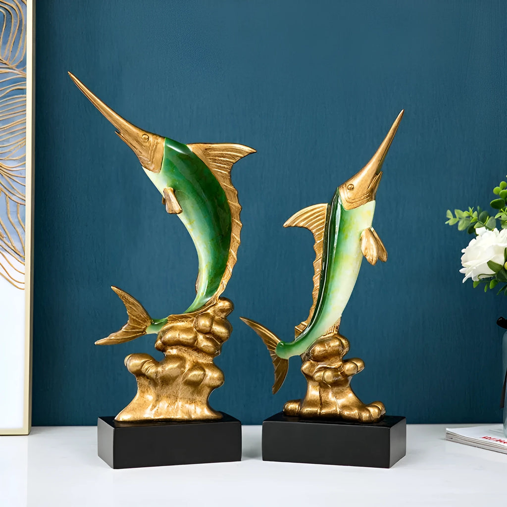 Close-up of a detailed resin European swordfish ornament in bright gold colour on a shelf.