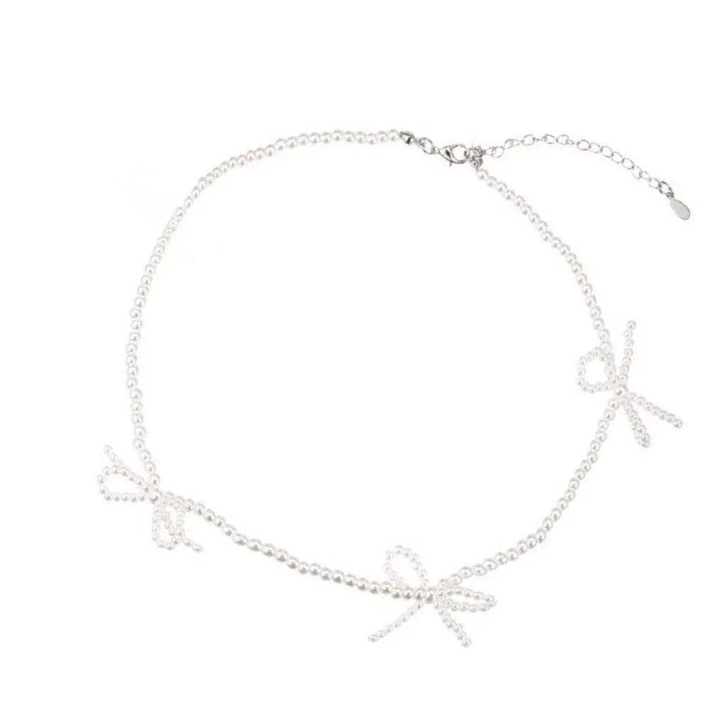 White sweet bow pearl necklace for women with adjustable length and geometric centrepiece