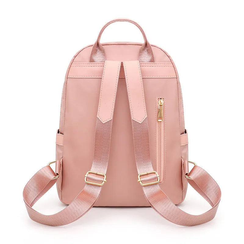 Women's black nylon casual backpack with multiple compartments and double shoulder straps