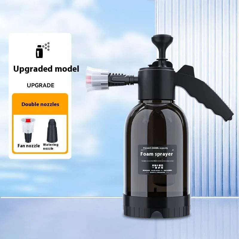 Black hand-held spray sprayer with 2 litre capacity, ergonomic handle, and two nozzles for watering and cleaning.
