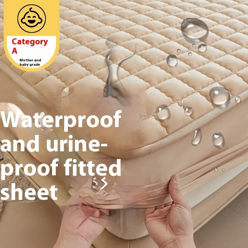 Class A waterproof fitted sheet in light grey colour, shown fitted neatly on a mattress.