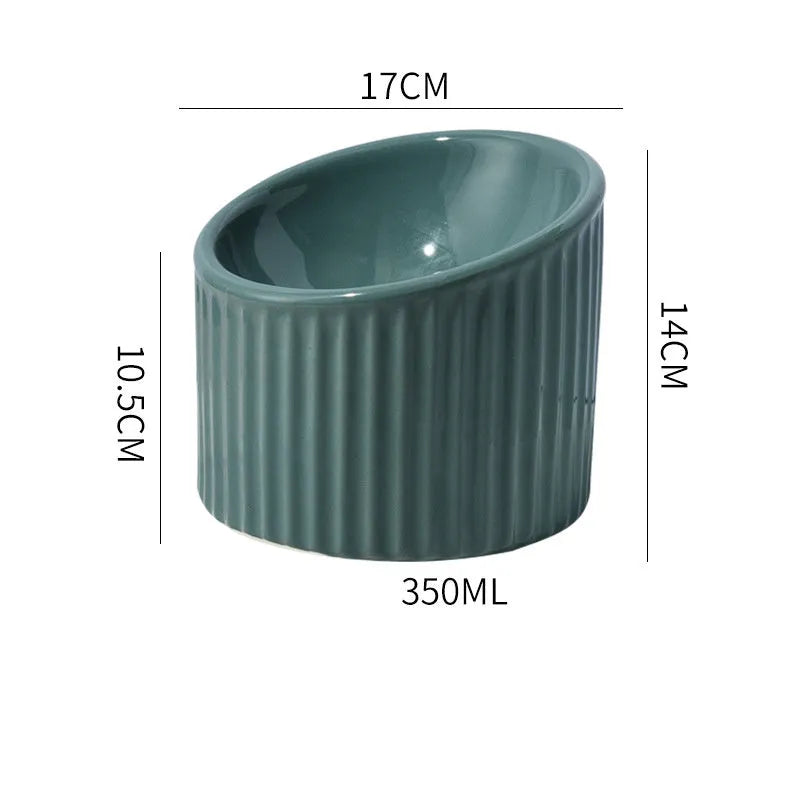 Elevated ceramic cat bowl in green colour with tilted design for whisker-friendly feeding