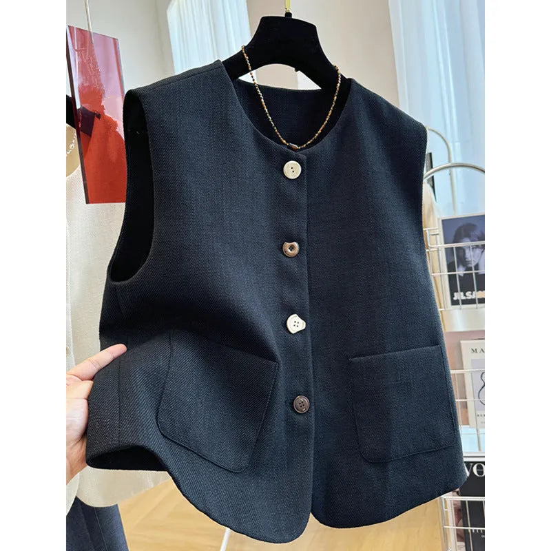 Women's milky white French-style bandage vest with round neck and sleeveless design on a hanger.