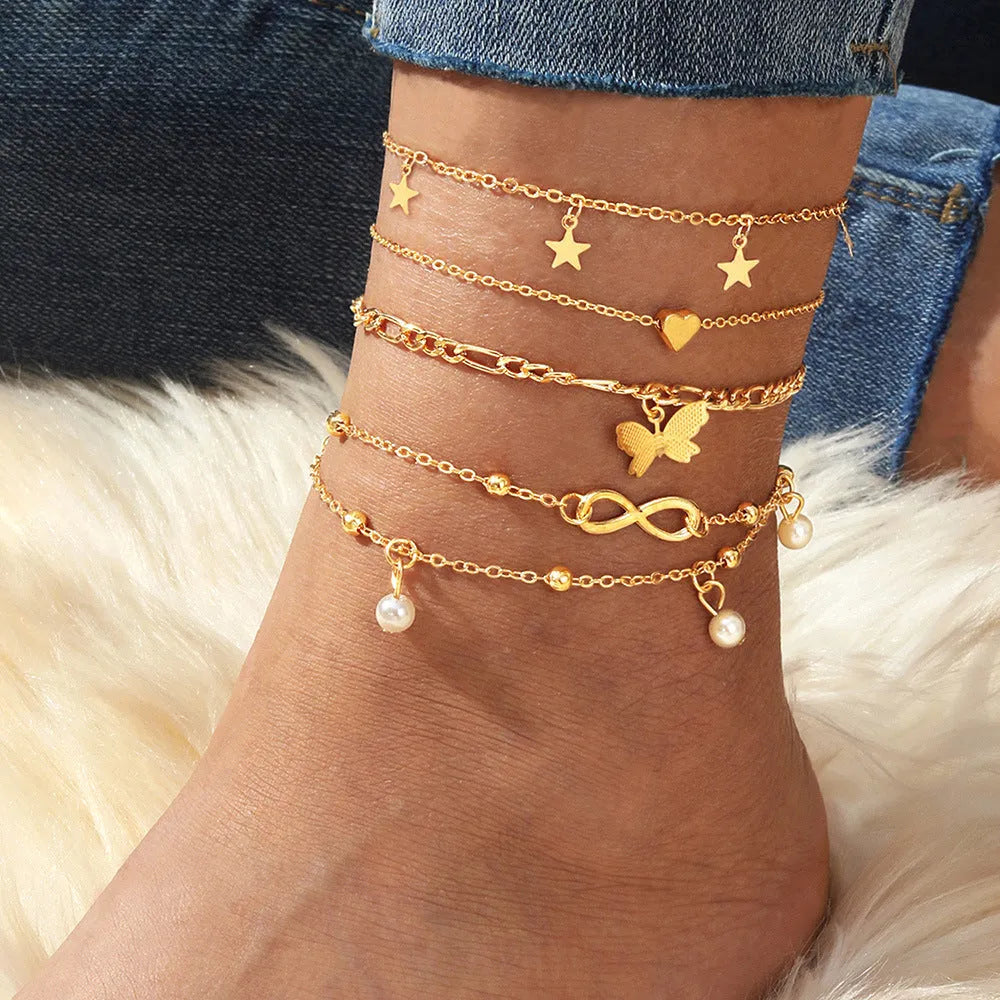 Butterfly pearl heart anklet jewellery set with four coordinated alloy foot chains