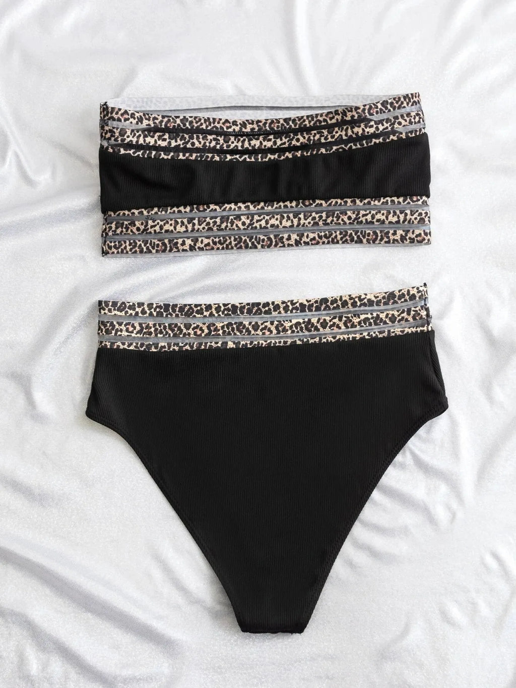 Black strapless bikini set with contrasting leopard print panels on the bra and shorts.