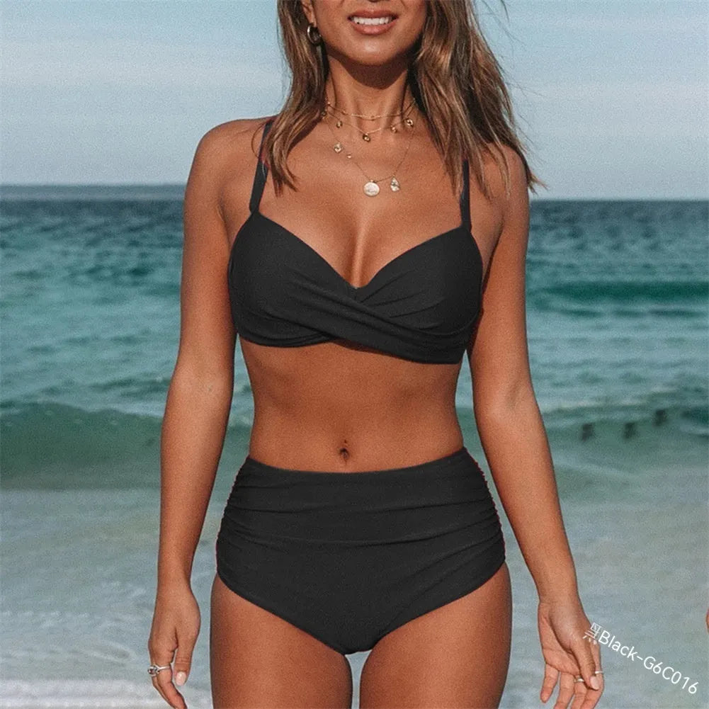 Women's solid colour bikini with cross-strap back, briefs bottom, in nylon fabric.