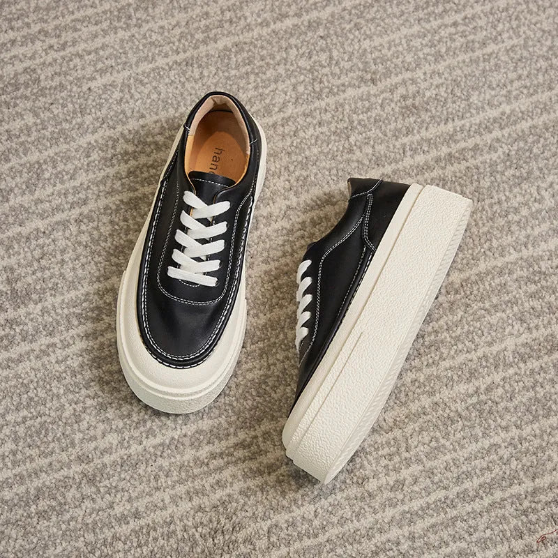 Women's black and white platform casual sports shoes with cowhide leather upper and round toe.