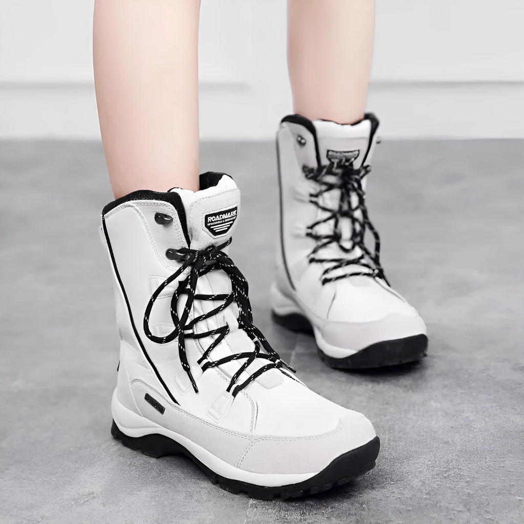 Women's black genuine leather mid-calf thermal snow boots with a rubber sole.