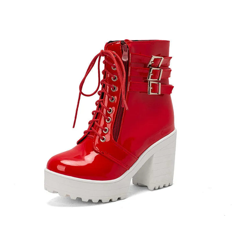 Women's black ankle boots with thick heel, round toe, and front lace-up on a waterproof platform sole.