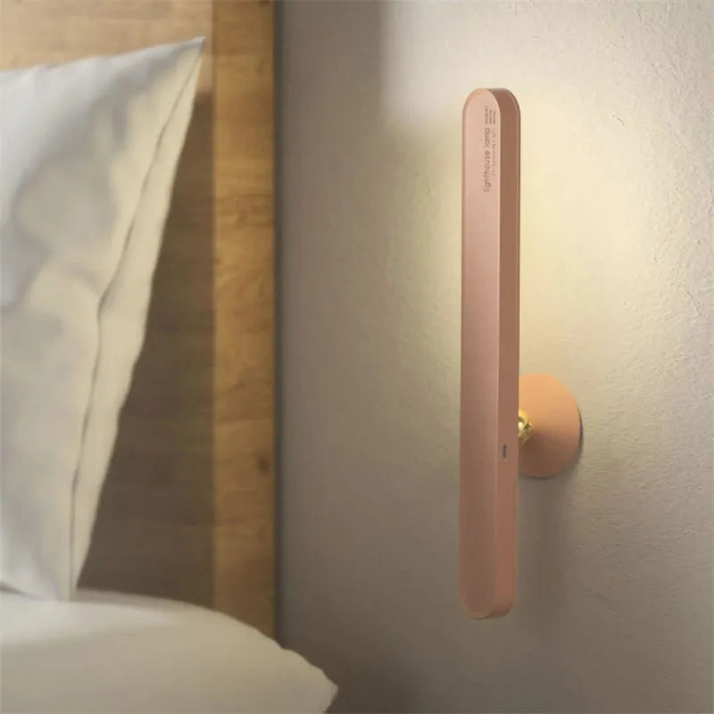 Geometric wireless table lamp with magnetic base in white colour showing touch controls