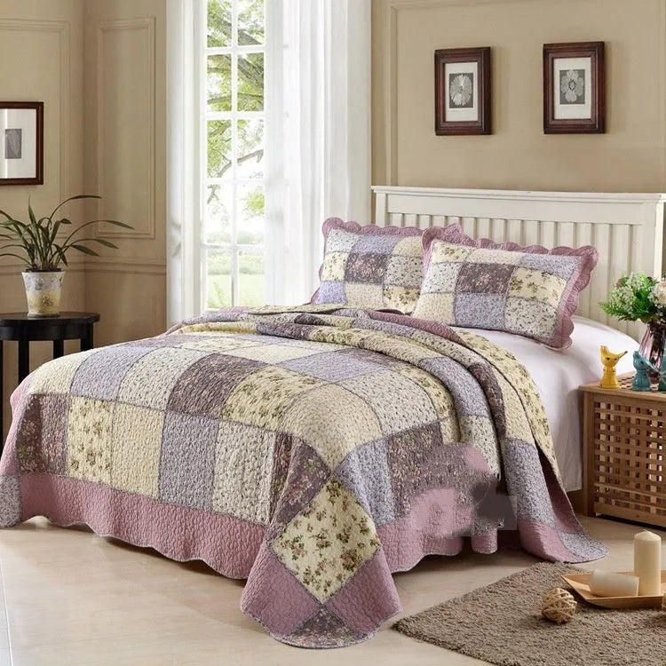 Pure cotton quilted bedspread three-piece set in washed fabric with pillowcases on a bed.