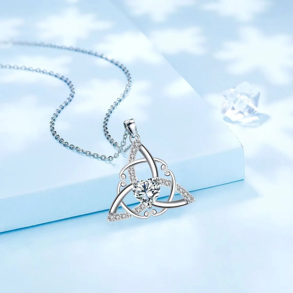 Copper Celtic knot necklace with geometric pendant in blue colour option, electroplated finish