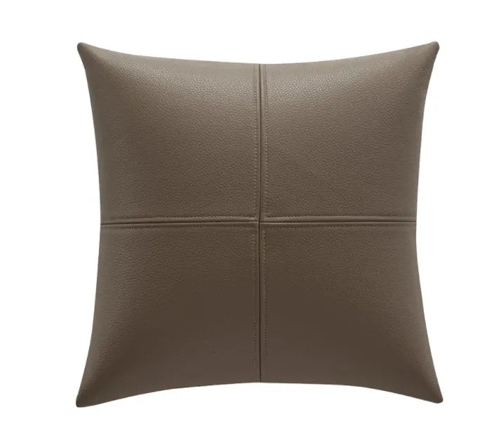 Soft cowhide leather pillow cover in a solid colour, shown in a Nordic-style room setting.