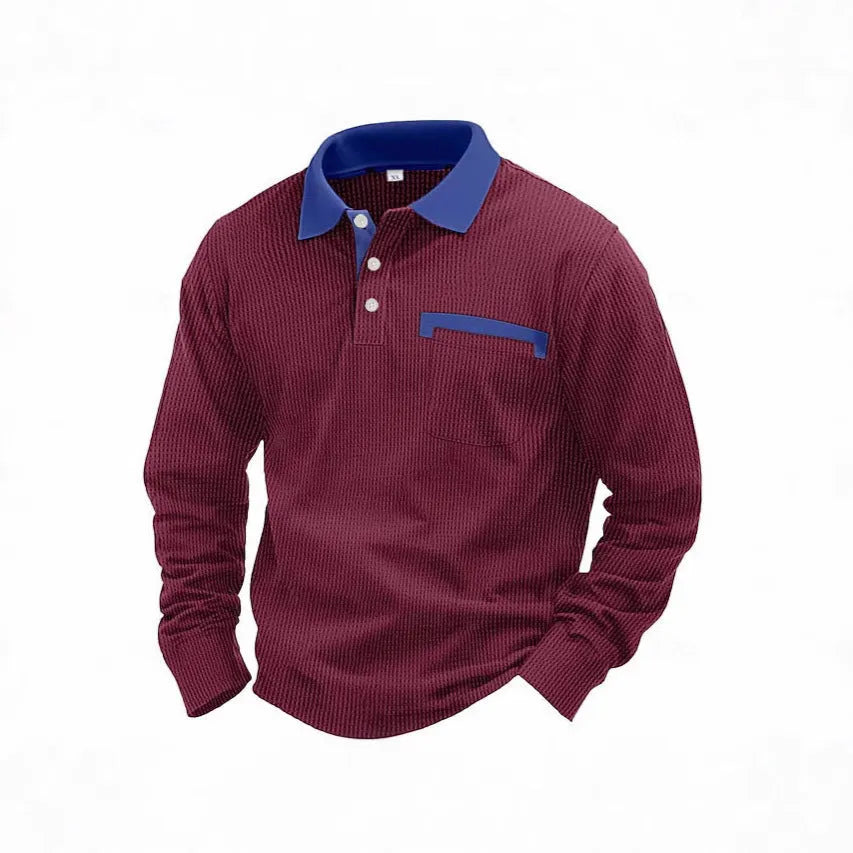 Man wearing a long-sleeved waffle-textured polo shirt in a loose fit with an asymmetric design detail.