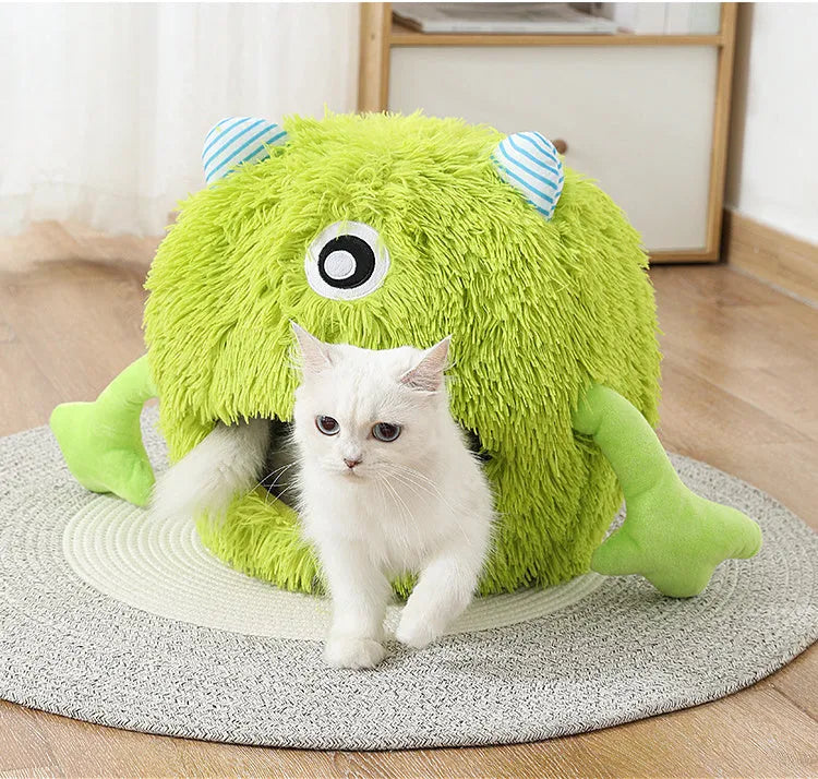 Fluffy round plush pet bed for cats and small dogs on a wooden floor