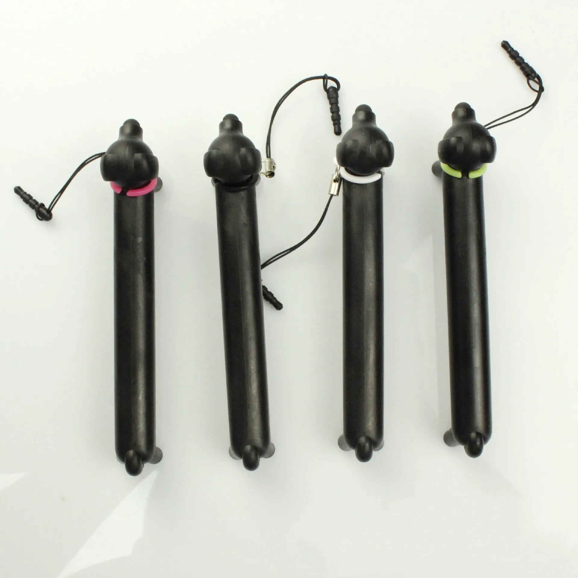 Black dog-shaped touch screen stylus with 12cm length shown on desk