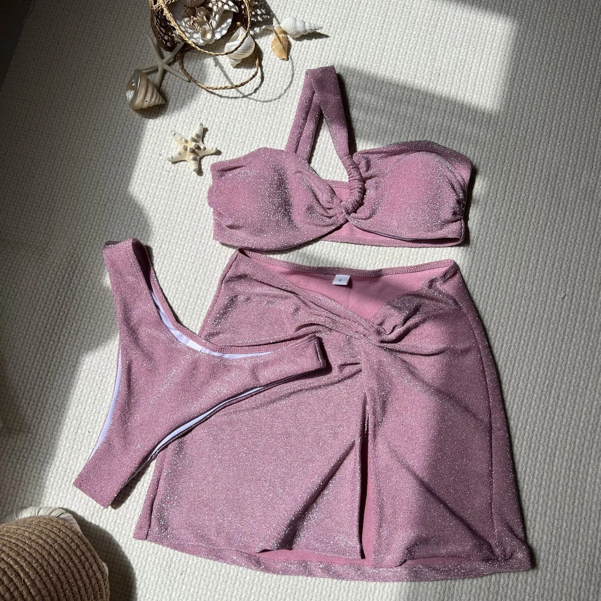 Women's one-shoulder tube top three-piece swimsuit set in glossy polyester with matching skirt