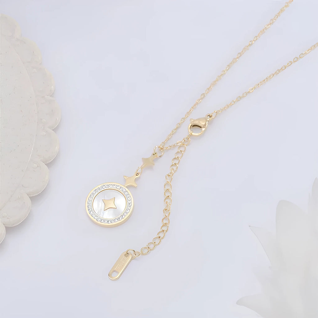 Gold six-pointed star titanium steel necklace on a model, showing the geometric pendant and O-ring chain.