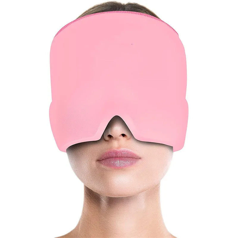 Black elastic cloth gel cold therapy eye mask for headache relief on grey background.