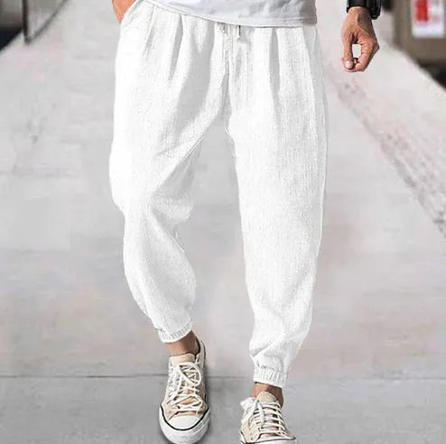 Men's loose cotton summer trousers with banded ankle cuff in light green colour