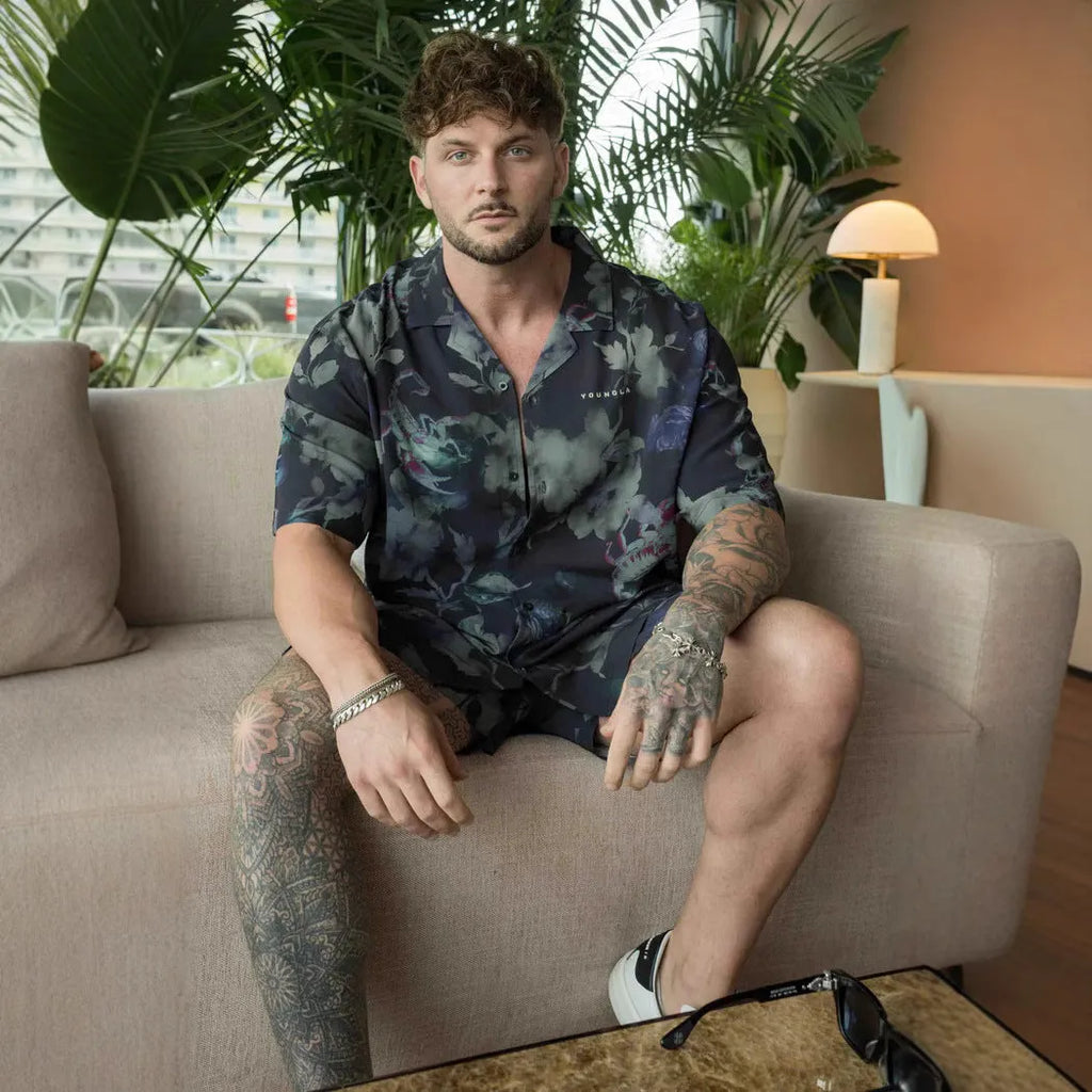 Men's loose fitting short sleeve top with floral print pattern in lightweight polyester fabric