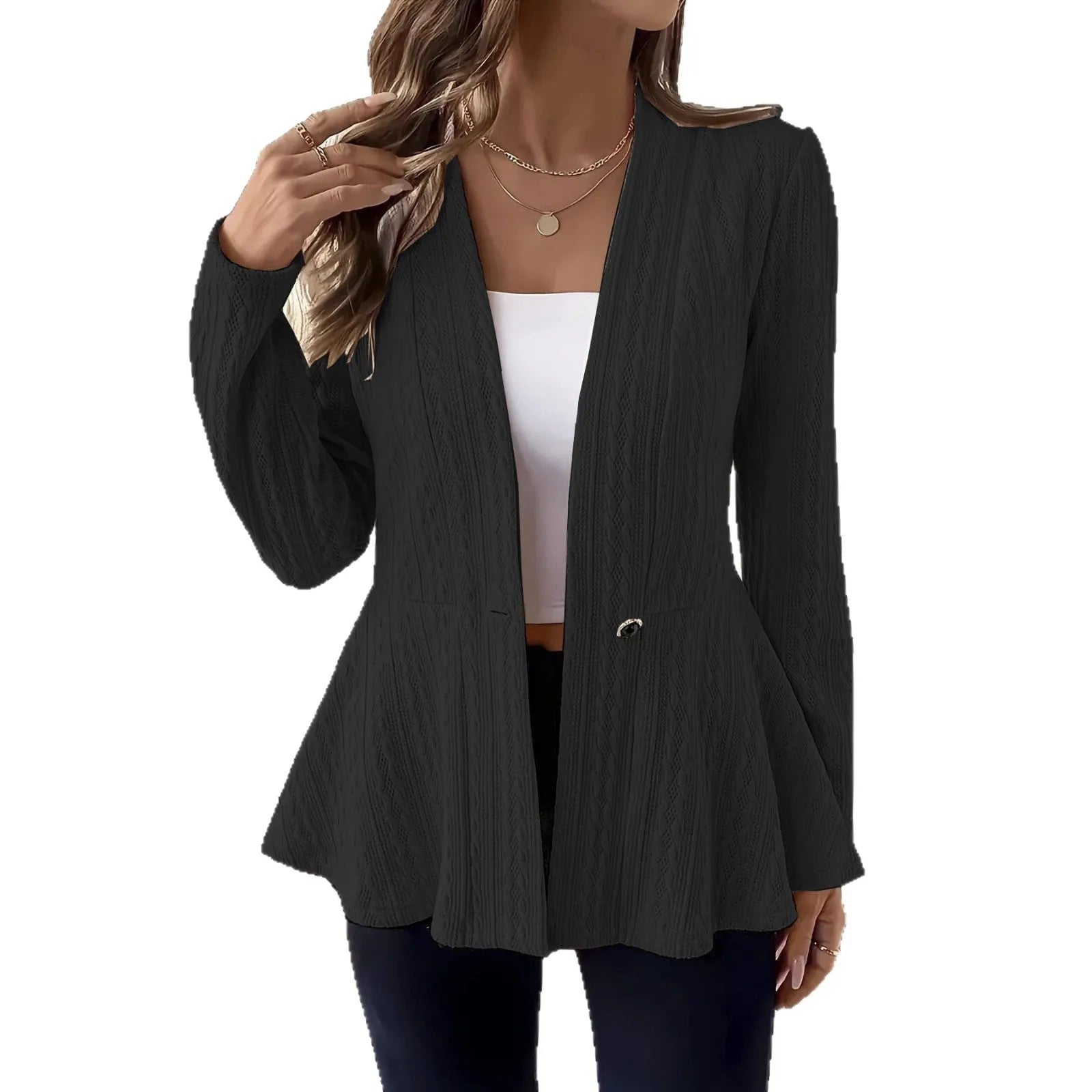 Women's apricot coloured knitted cardigan with jacquard pattern and one button, shown on a model.