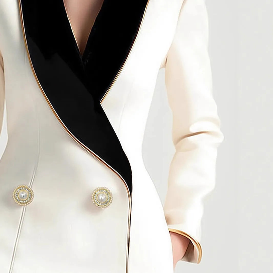 Women's milky white irregular cut coat with gold trim and pearl buttons