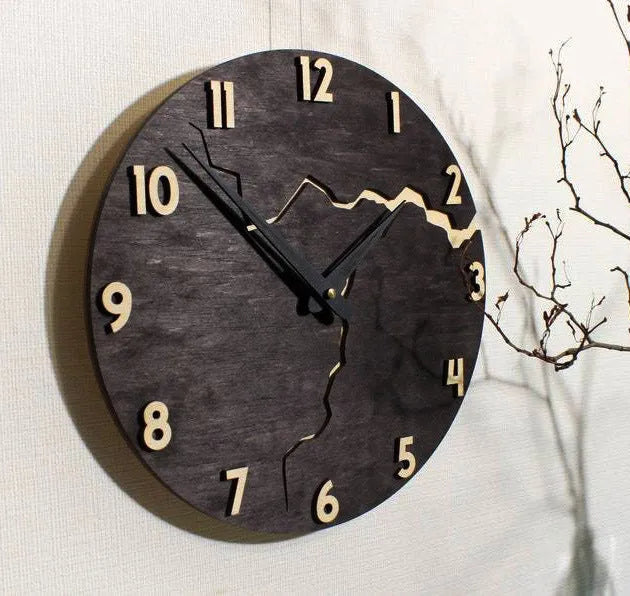 Modern simple wooden wall clock with Arabic numerals on face, shown in a neutral colour finish.