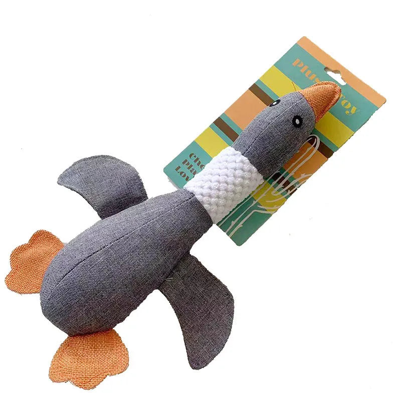 Blue duck-shaped plush dog toy with squeakers for chewing and interactive play