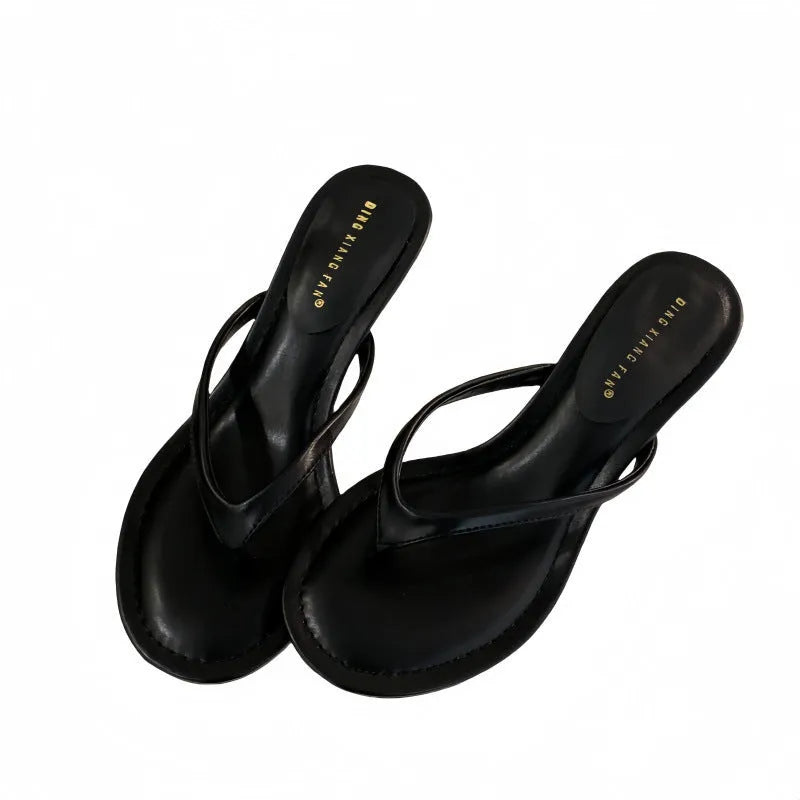 Women's black stiletto heel flip-flop sandals with round toe design