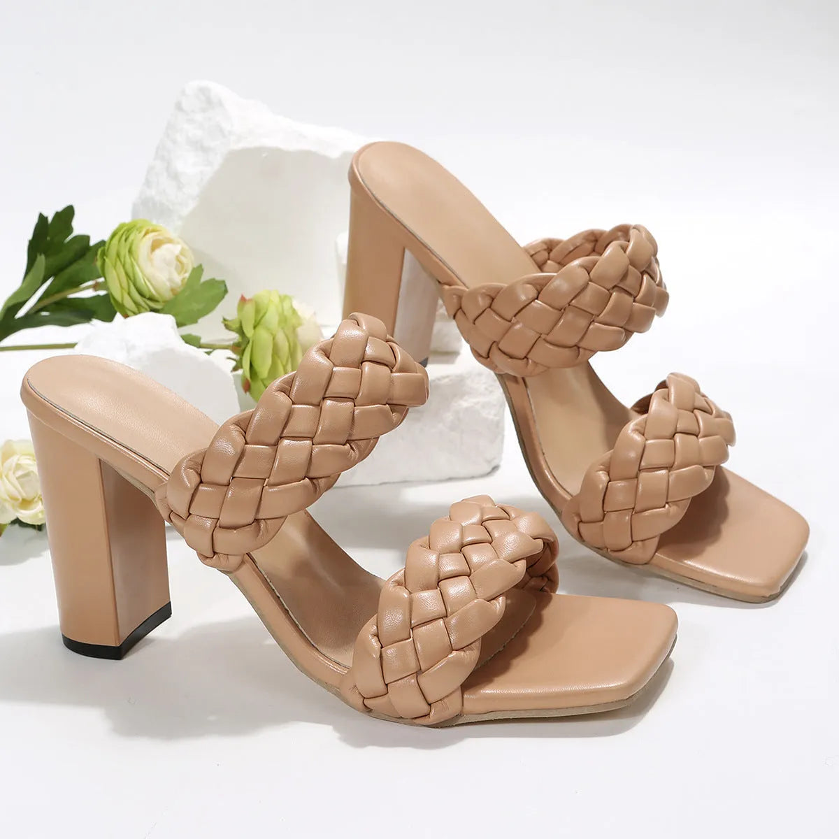 White square toe flip flops with a chunky woven heel and twisted PU strap on a rubber sole.