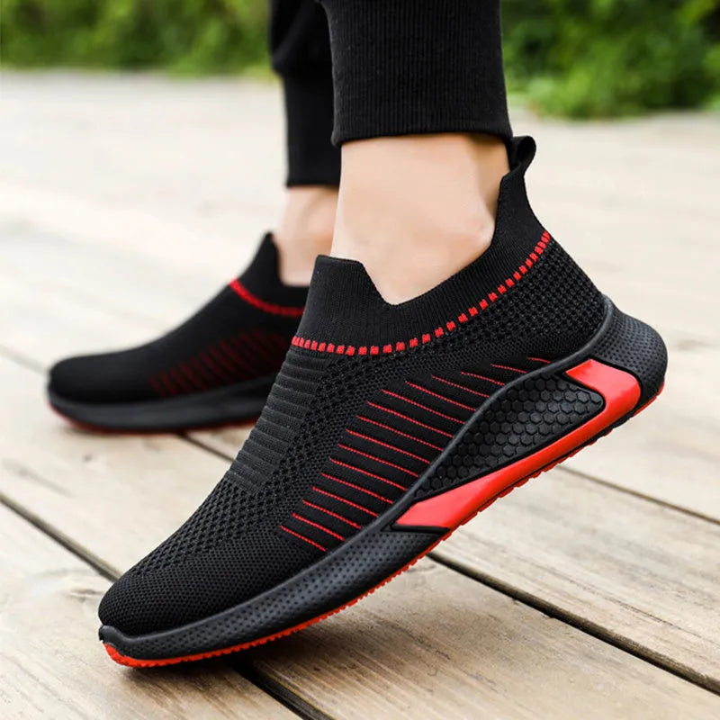 Men's black and white striped mesh sock shoes with lace-up front on a white background