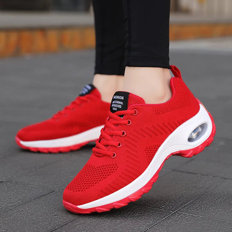 Women's black mesh sneakers with round toe and front lace-up design showing 3-5 cm mid heel